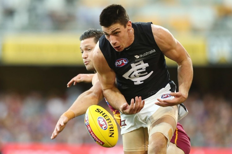 STEFAN MARTIN of the Lions and MATTHEW KREUZER of the Blues compete for the ball during the AFL match between the Brisbane Lions and the Carlton Blues at The Gabba in Brisbane, Australia.