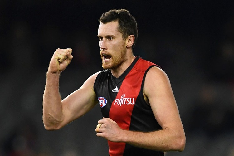 MATTHEW LEUENBERGER of the Bombers celebrates after kicking a goal during the AFL match between the Essendon Bombers and the Greater Western Sydney Giants at Etihad Stadium in Melbourne, Australia.