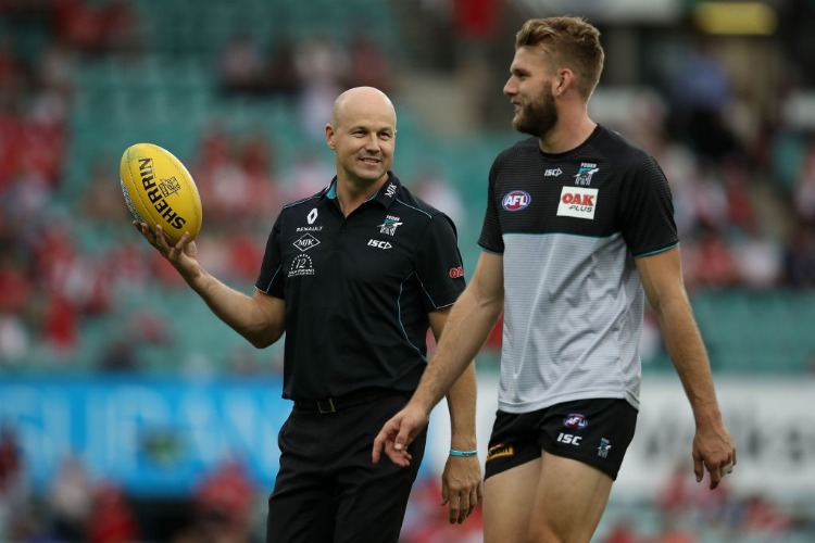 Power Senior Assistant coach MATTHEW NICKS speaks to Jackson Trengove of the Power during warm-up ahead ofthe AFL match between the Sydney Swans and the Port Adelaide Power at SCG in Sydney, Australia.