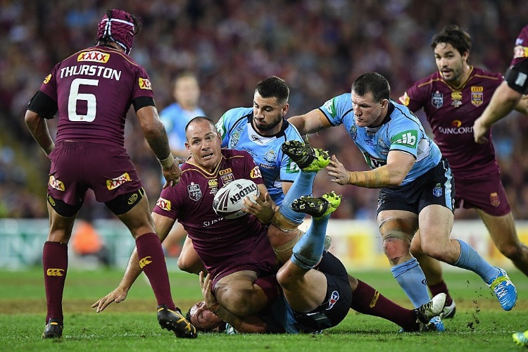 MATTHEW SCOTT of the Maroons offloads during the State Of Origin series between the Queensland Maroons and the New South Wales Blues at Suncorp Stadium in Brisbane, Australia.