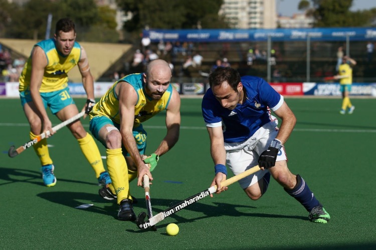 PIETER VAN STRAATEN of France and MATTHEW SWANN of Australia battle for possession during day 2 of the FIH Hockey World League Semi Finals Pool A match between Australia and France at Wits University in Johannesburg, South Africa.