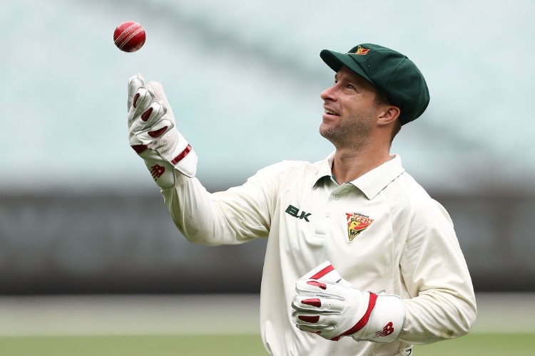 MATTHEW WADE of Tasmania waits for the start of play during the Sheffield Shield match between Victoria and Tasmania at MCG in Melbourne, Australia.
