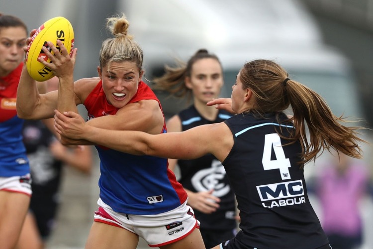 MELISSA HICKEY of the Demons is challenged by Madeline Keryk of the Blues during the AFLW match between the Carlton Blues and the Melbourne Demons at Ikon Park in Melbourne, Australia. MELISSA HICKEY of the Demons is challenged by Madeline Keryk of the Blues during the AFLW match between the Carlton Blues and the Melbourne Demons at Ikon Park in Melbourne, Australia.