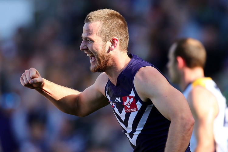MICHAEL APENESS of the Dockers celebrates a goal during the AFL match between the Fremantle Dockers and the West Coast Eagles at DS in Perth, Australia.