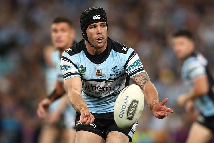 MICHAEL ENNIS of the Sharks offloads the ball during the 2016 NRL Grand Final match between the Cronulla Sharks and the Melbourne Storm at ANZ Stadium in Sydney, Australia. MICHAEL ENNIS of the Sharks offloads the ball during the 2016 NRL Grand Final match between the Cronulla Sharks and the Melbourne Storm at ANZ Stadium in Sydney, Australia.