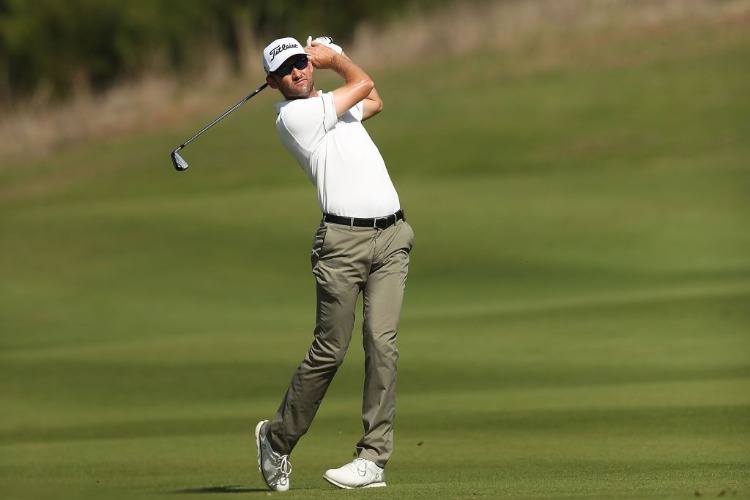 MICHAEL SIM of Australia hits an approach shot during the Fiji International at Natadola Bay Championship Golf Course in Suva, Fiji. MICHAEL SIM of Australia hits an approach shot during the Fiji International at Natadola Bay Championship Golf Course in Suva, Fiji.