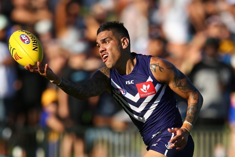 MICHAEL WALTERS of the Dockers attempts to mark the ball on the boundary line during the JLT Community Series AFL match between the Fremantle Dockers and the West Coast Eagles at HBF Arena in Perth, Australia.