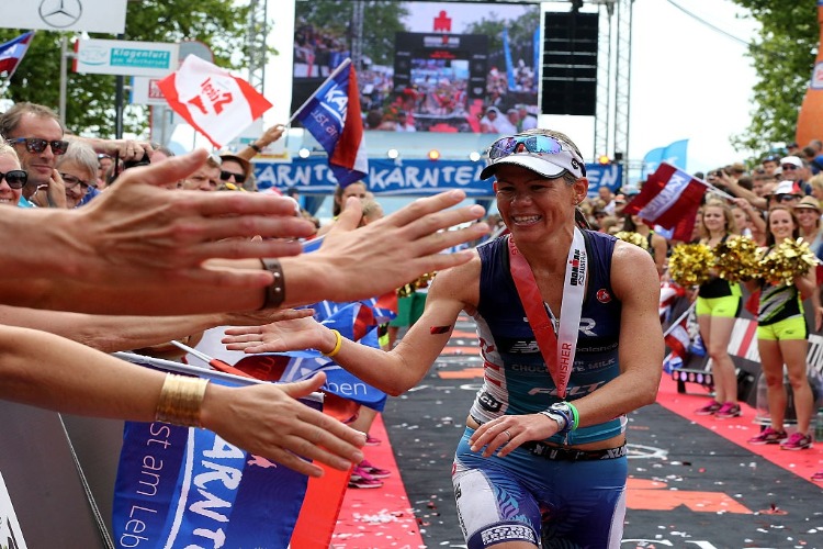 MIRINDA CARFRAE of Australia celebrates winning the women's race of Ironman Austria in Klagenfurt, Austria.