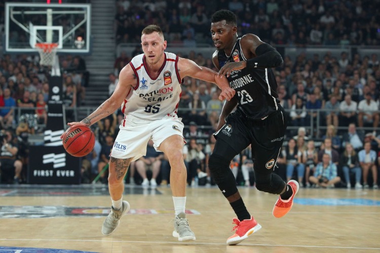 MITCH CREEK of the Adelaide 36ers (L) in action during the NBL Grand Final series between Melbourne United and the Adelaide 36ers at Hisense Arena in Melbourne, Australia.