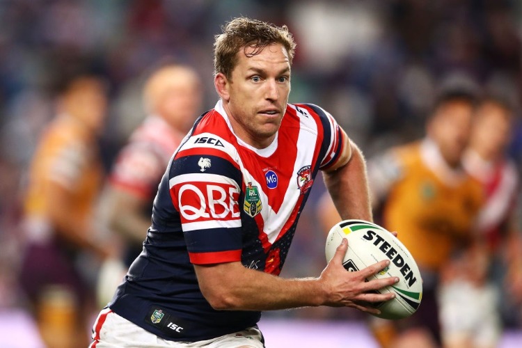 MITCHELL AUBUSSON of the Roosters runs the ball during the NRL match between the Sydney Roosters and the Brisbane Broncos at AS in Sydney, Australia.