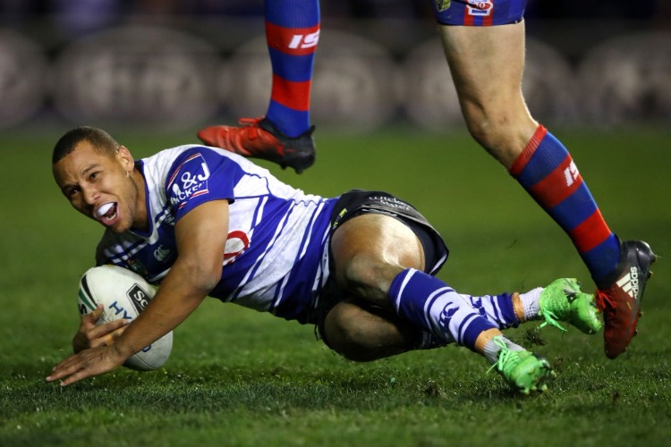 MOSES MBYE of the Bulldogs scores the winning try during the NRL match between the Canterbury Bulldogs and the Newcastle Knights at Belmore Sports Ground in Sydney, Australia.