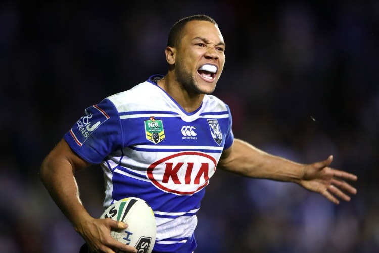 MOSES MBYE of the Bulldogs celebrates scoring the winning try during the NRL match between the Canterbury Bulldogs and the Newcastle Knights at Belmore Sports Ground in Sydney, Australia.