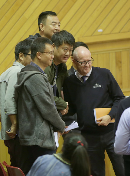 Mr Lang Lin (centre) being congratulated with his purchase by New Zealand Bloodstock Managing Director Andrew Seabrook