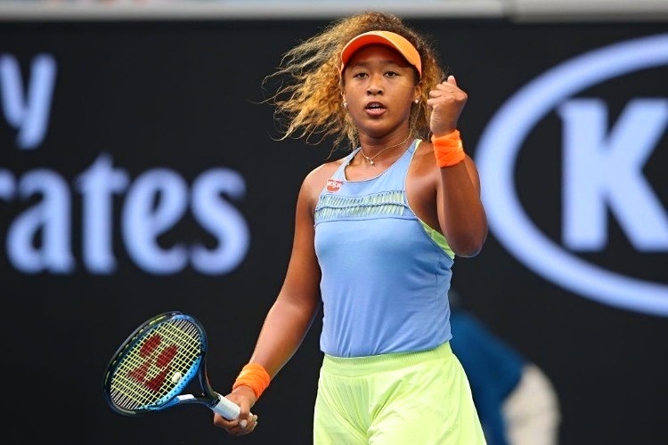 NAOMI OSAKA of Japan celebrates winning a point against Ashleigh Barty of Australia of the 2018 Australian Open at Melbourne Park in Australia.