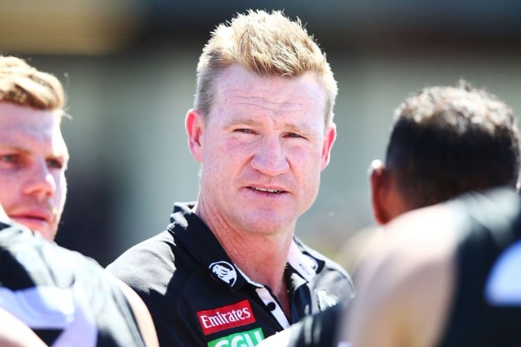Magpies head coach NATHAN BUCKLEY speaks to his players during the JLT Community Series AFL match between Collingwood Magpies and the Western Bulldogs at Ted Summerton Recreational Reserve in Moe, Australia.