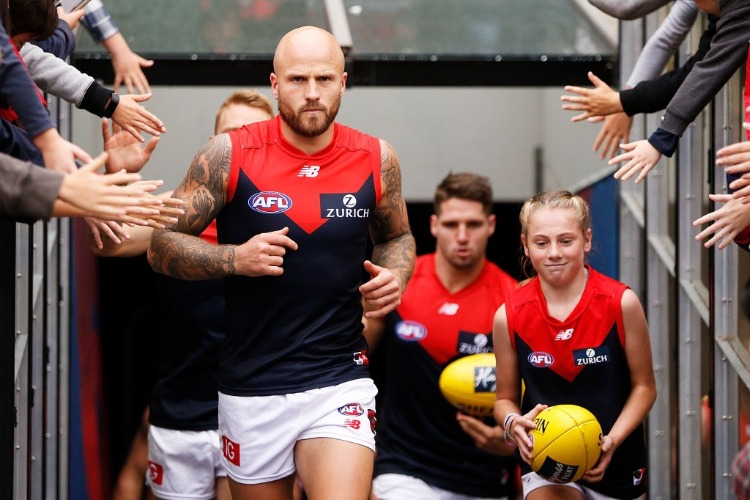 NATHAN JONES of the Demons leads his team out during the AFL match between the Hawthorn Hawks and the Melbourne Demons at MCG in Melbourne, Australia.