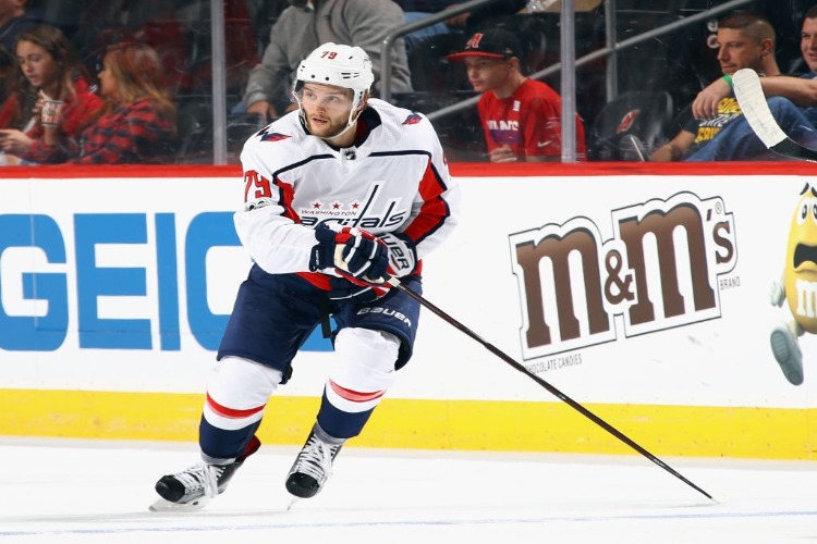 NATHAN WALKER #79 of the Washington Capitals skates against the New Jersey Devils during a preseason game at the Prudential Center in Newark, New Jersey.