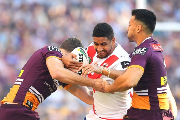 NENE MACDONALD of the Dragons is tackled during the NRL Elimination Final match between the Brisbane Broncos and the St George Illawarra Dragons at SS in Brisbane, Australia.