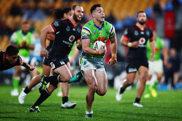 NICK COTRIC of the Raiders makes a break to socre a try during the NRL match between the New Zealand Warriors and the Canberra Raiders at Mt Smart Stadium in Auckland, New Zealand.