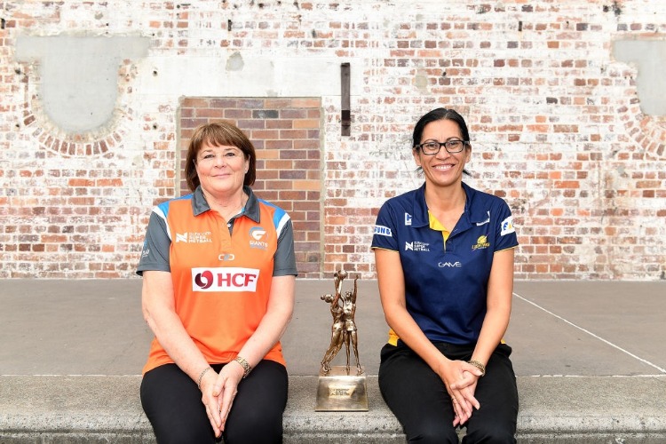 Coach Julie Fitzgerald of the Giants and Coach NOELINE TAURUA of the Sunshine Coast Lightning pose for a photo during the Super Netball Grand Final media opportunity at Brisbane Powerhouse in Brisbane, Australia.