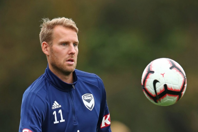 OLA TOIVONEN of the Victory trains away from the main group of players during training session in Melbourne, Australia.