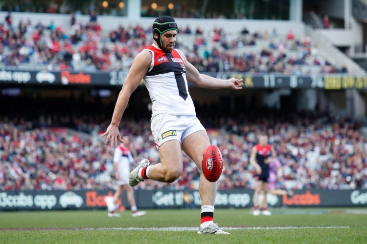 PADDY MCCARTIN of the Saints kicks the ball during the 2018 AFL match between the Melbourne Demons and the St Kilda Saints at the MCG in Melbourne, Australia.