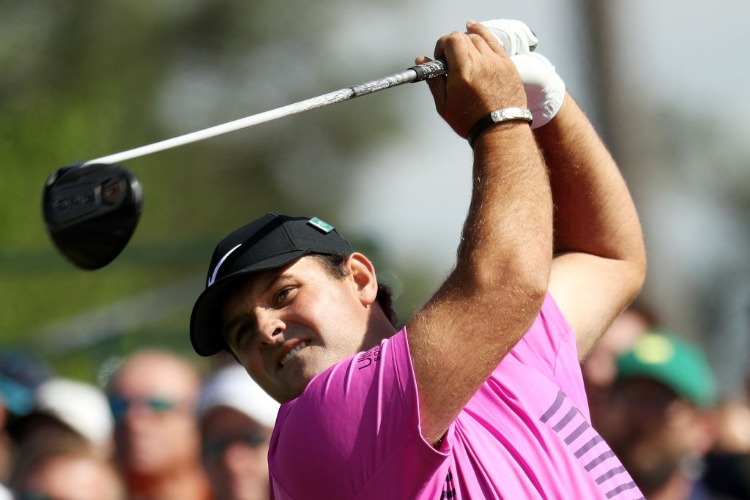 PATRICK REED of the United States plays his shot from the eighth tee during the 2018 Masters Tournament at Augusta National Golf Club in Augusta, Georgia.
