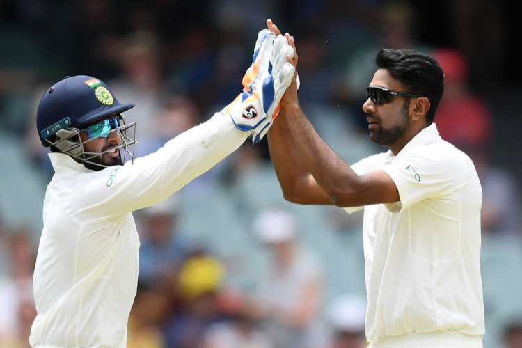 RAVICHANDRAN ASHWIN and RISHABH PANT of India celebrate getting a wicket of the First Test match in the series between Australia and India in Adelaide, Australia.