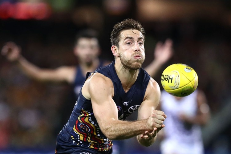 RICHARD DOUGLAS of the Crows handballs during the AFL match between the Adelaide Crows and the Fremantle Dockers at Adelaide Oval in Adelaide, Australia.