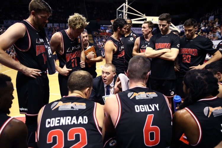 Hawks head coach ROB BEVERIDGE speaks to his players during a time out during the NBL match between the Illawarra Hawks and the Perth Wildcats in Wollongong, Australia. Hawks head coach ROB BEVERIDGE speaks to his players during a time out during the NBL match between the Illawarra Hawks and the Perth Wildcats in Wollongong, Australia.
