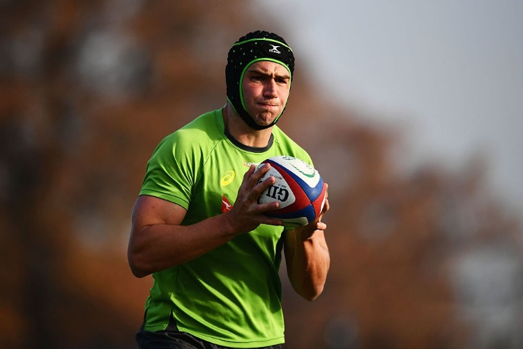 ROB SIMMONS catches the ball during an Australia training session at Harrow School in London, England.