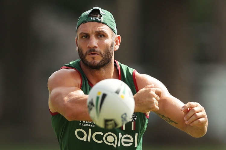 ROBBIE FARAH passes during a South Sydney Rabbitohs NRL training session at Redfern Oval in Sydney, Australia.