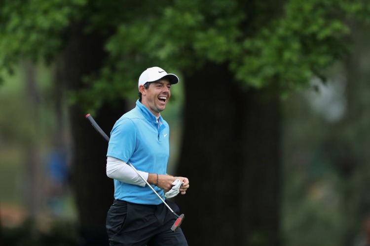 RORY MCILROY of Northern Ireland reacts to a shot from a bunker on the fifth hole during the third round of the 2018 Masters Tournament at Augusta National Golf Club in Augusta, Georgia.