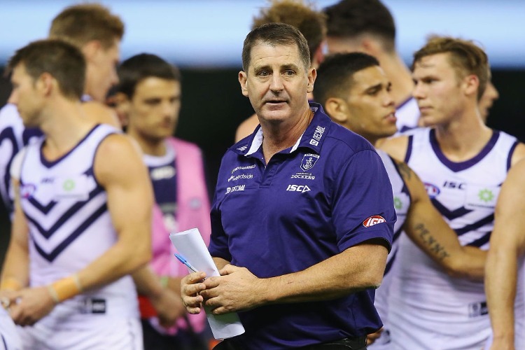 Dockers head coach ROSS LYON walks off at quarter time during the AFL match between North Melbourne v Fremantle at Etihad Stadium in Melbourne, Australia.