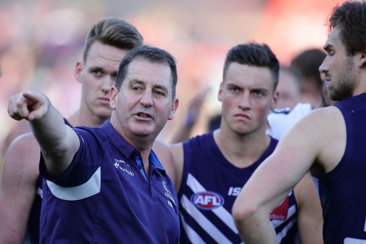 ROSS LYON, Senior Coach of the Dockers, addresses the players at the three quarter time break during the AFL match between the Fremantle Dockers and the Richmond Tigers at Domain Stadium in Perth, Australia.