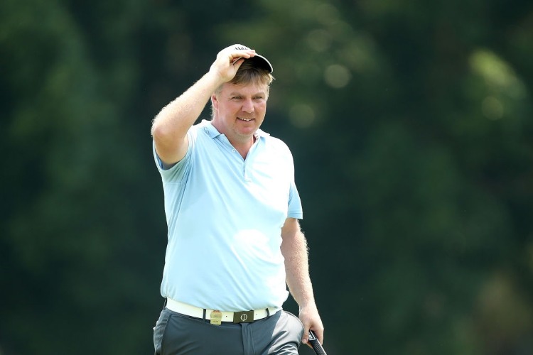 ROSS MCGOWAN waves to the crowd after getting a course record during the Australian PGA Championship at Royal Pines Resort in Gold Coast, Australia.