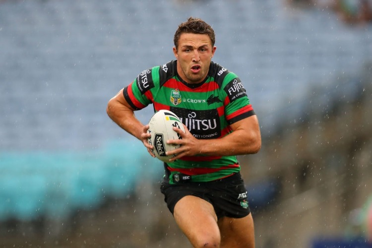 SAM BURGESS of the Rabbitohs is runs the ball during the NRL match between the South Sydney Rabbitohs and the Manly Sea Eagles at ANZ Stadium in Sydney, Australia.