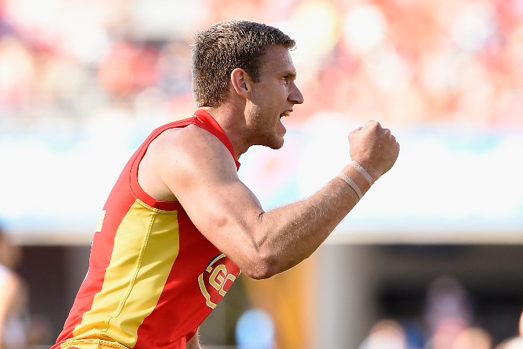 SAM DAY of the Suns celebrates kicking a goal during the AFL match between the Gold Coast Suns and the Fremantle Dockers at Metricon Stadium in Gold Coast, Australia.