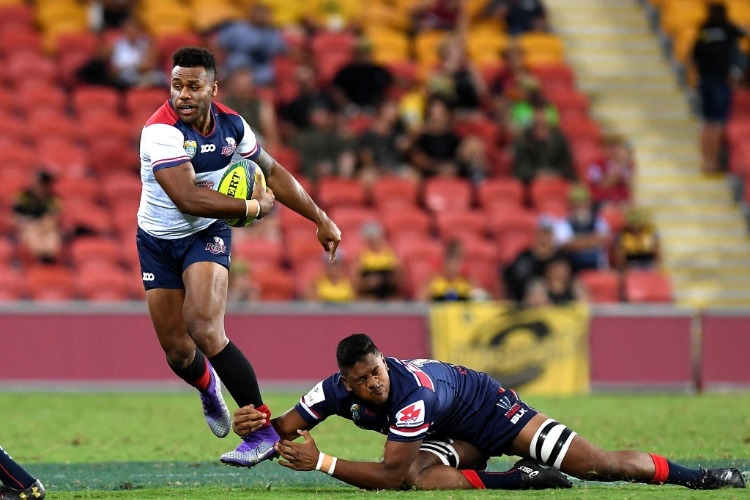 SAMU KEREVI of the Reds breaks away from the defence during the 2018 Global Tens match between the Queensland Reds and the Melbourne Rebels at Suncorp Stadium in Brisbane, Australia.