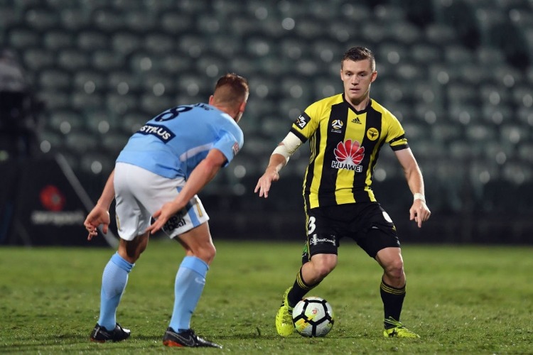 SCOTT GALLOWAY of the Phoenix makes a break during the A-League match between the Wellington Phoenix and Melbourne City FC at QBE Stadium in Auckland, New Zealand.