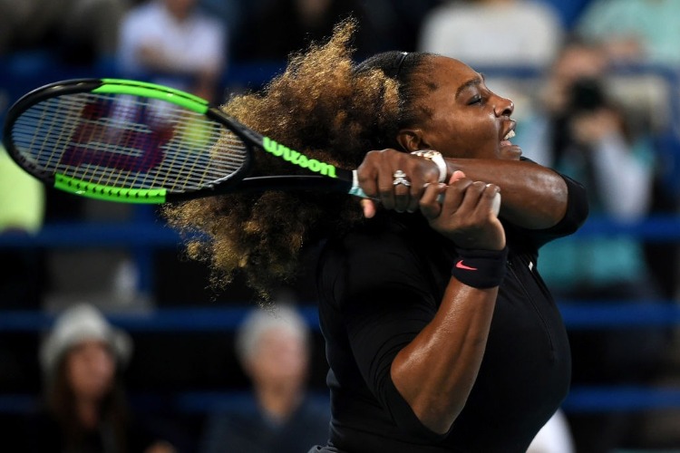 SERENA WILLIAMS of United States plays a backhand during her Ladies Final match of Mubadala World Tennis Championship in Abu Dhabi, United Arab Emirates.