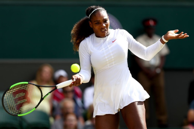 SERENA WILLIAMS of the United States plays a forehand against Camila Giorgi of Italy during their Ladies' Singles Quarter-Finals match of the Wimbledon Lawn Tennis Championships at All England Lawn Tennis and Croquet Club in London, England.