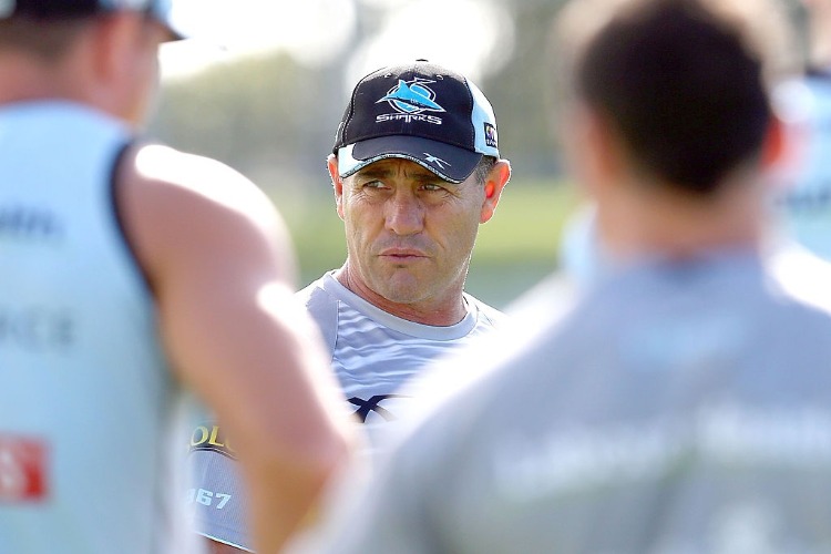 Coach SHANE FLANAGAN talks to his players during a Cronulla Sharks NRL training session at Remondis Stadium in Sydney, Australia.