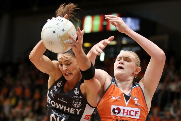 SHARNI LAYTON of the Magpies wins the ball over KRISTINA BRICE of the Giants during the Super Netball Major Semi Final match between the Giants and the Magpies at Sydney Olympic Park Sports Centre in Sydney, Australia.