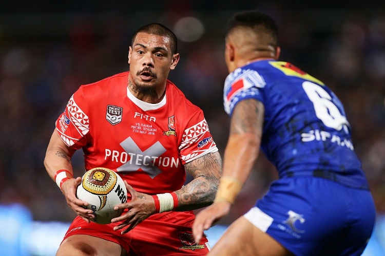 SIKA MANU of Tonga takes on the defence during the International Rugby League Test match between Tonga and Samoa at Pirtek Stadium in Sydney, Australia.