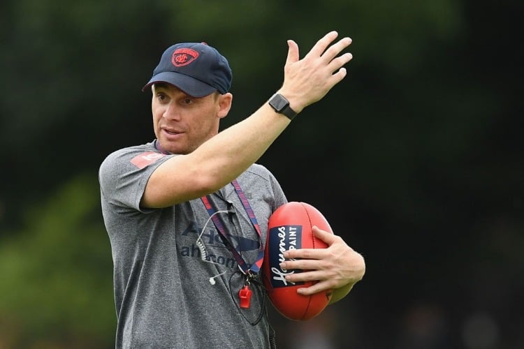Demons head coach SIMON GOODWIN gives instructions during a Melbourne Demons AFL training session at Gosch's Paddock in Melbourne, Australia.