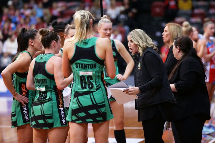 Fever coach STACEY MARINKOVICH talks to players during a time out during the Super Netball match between the Swifts and the Fever at Sydney Olympic Park Sports Centre in Sydney, Australia.