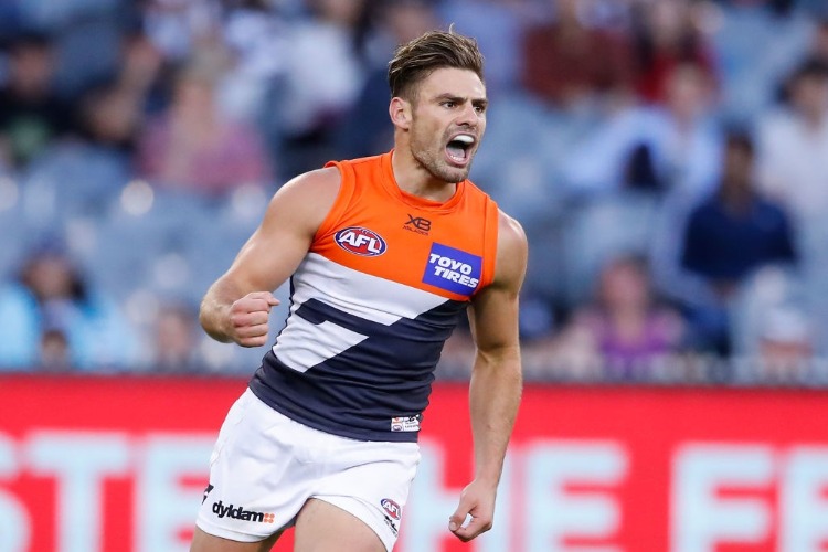 STEPHEN CONIGLIO of the Giants celebrates after kicking a goal during the AFL match between the Collingwood Magpies and the Greater Western Sydney Giants at MCG in Melbourne, Australia.