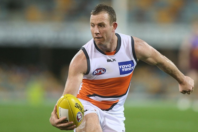 STEVE JOHNSON of the Giants handballs during the AFL match between the Brisbane Broncos and the Greater Western Sydney Giants at The Gabba in Brisbane, Australia.