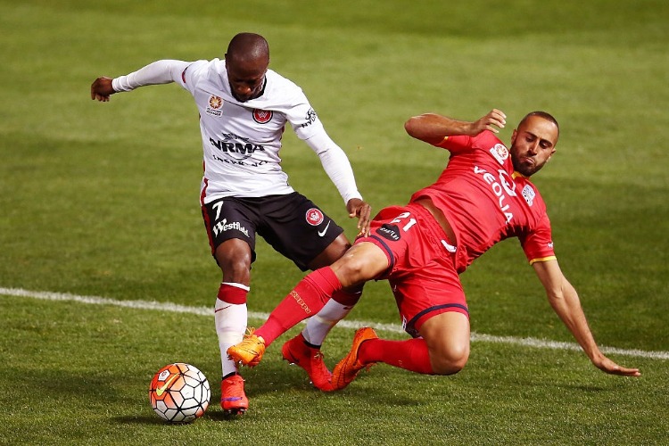 Romeo Castelen of the Wanderers is tackled by TAREK ELRICH of Adelaide United during the A-League match between Adelaide United and the Western Sydney Wanderers at Coopers Stadium in Adelaide, Australia. Romeo Castelen of the Wanderers is tackled by TAREK ELRICH of Adelaide United during the A-League match between Adelaide United and the Western Sydney Wanderers at Coopers Stadium in Adelaide, Australia.